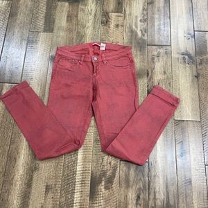 Maroon snakeskin skinny jeans